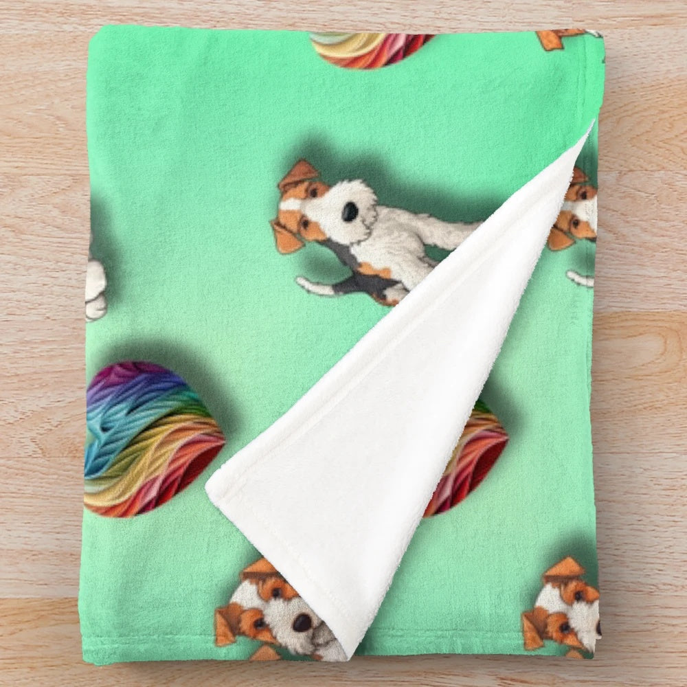 Wire Haired Fox Terrier on a plush rainbow heart-patterned blanket