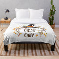 Cozy plush blanket with witch-themed design for fall and Halloween