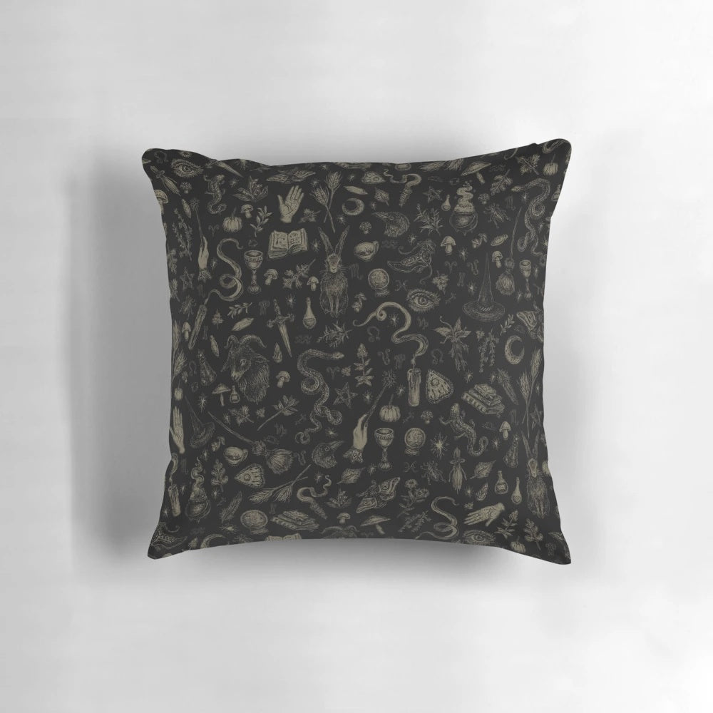 Black and beige pillow featuring a witch-themed design, perfect for adding a touch of spooky magic to your home.