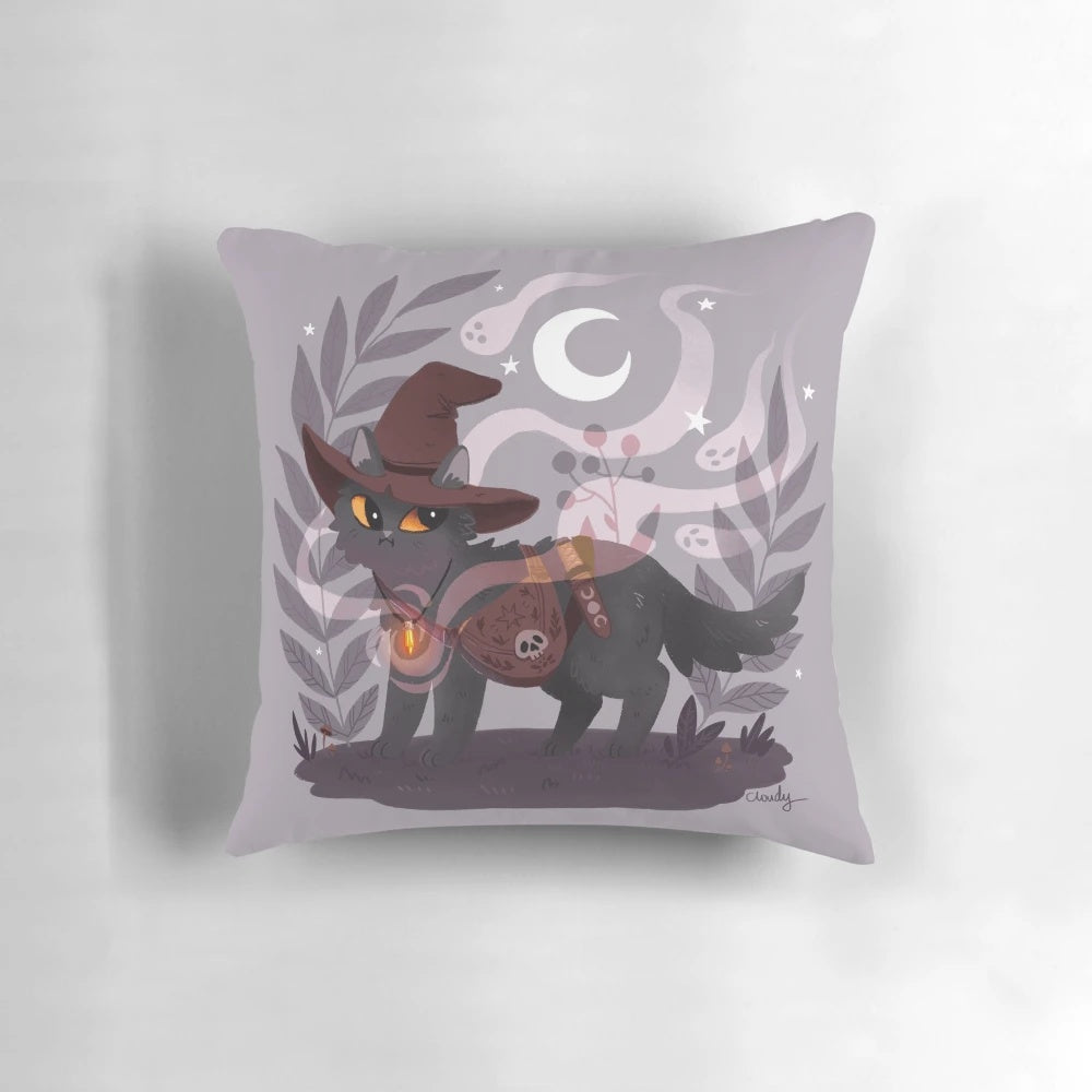Soft, plush pillow with a witchy, magical design featuring a black cat, moon, and witch hat on a dark background