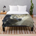Soft and cuddly plush blanket with a wolf design, perfect for nature enthusiasts