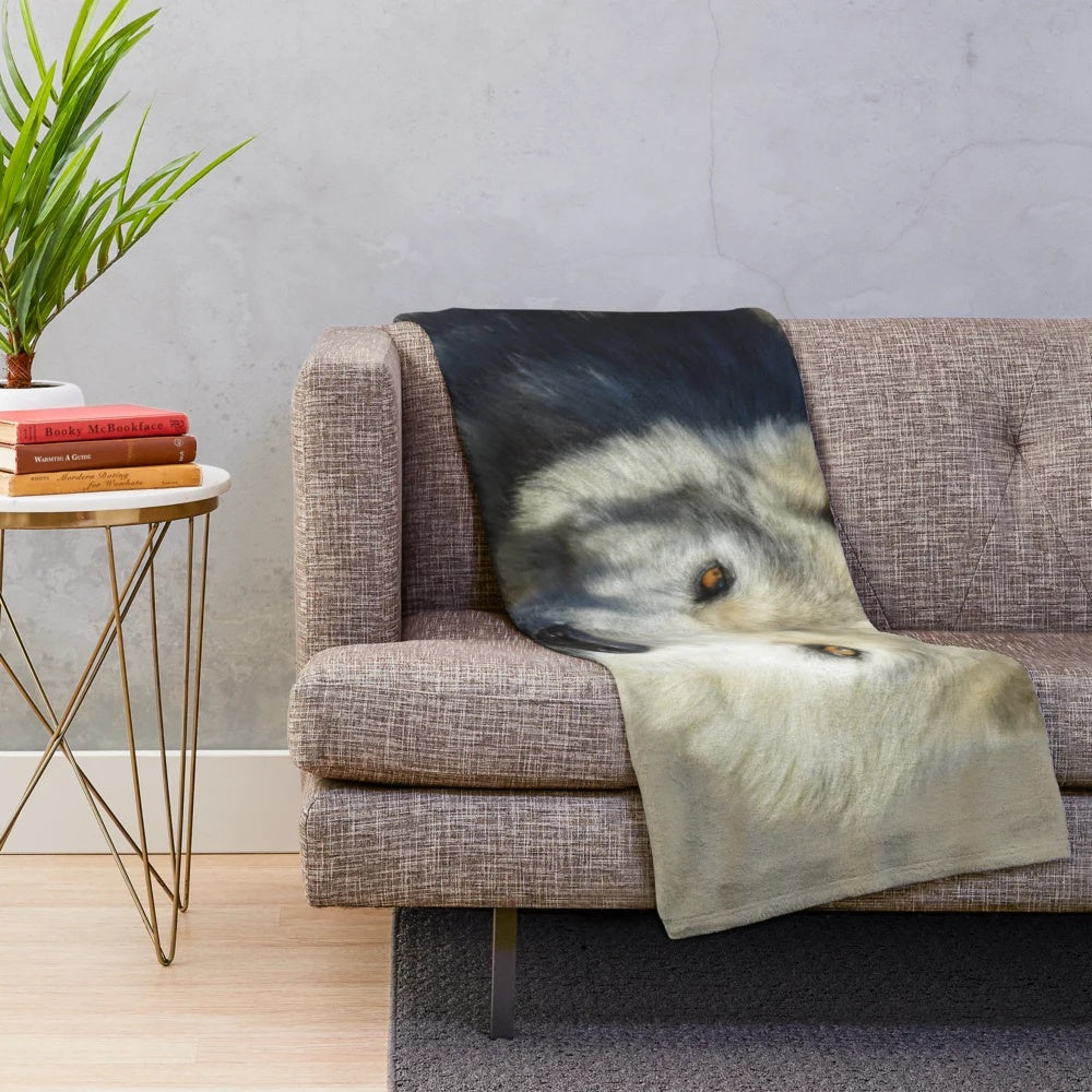 Soft and cuddly plush blanket with a wolf design, perfect for nature enthusiasts