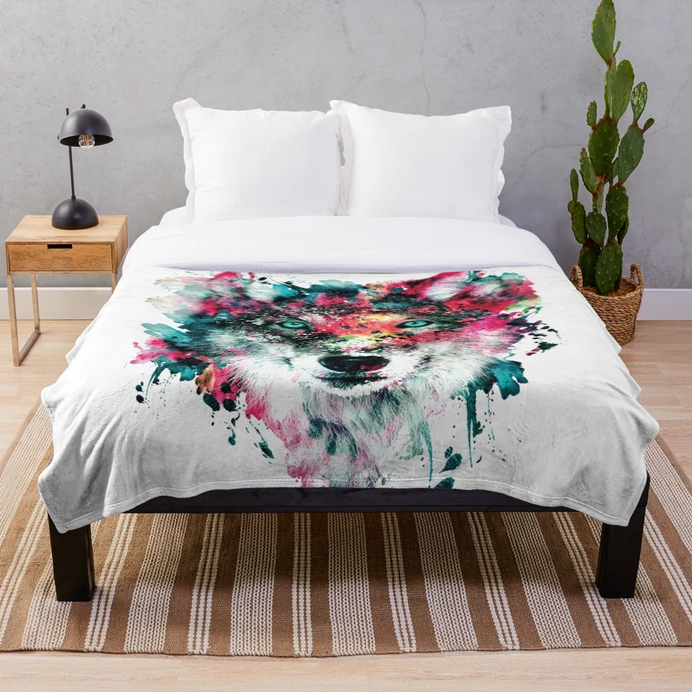 Colorful abstract wolf face design on a plush and cozy blanket