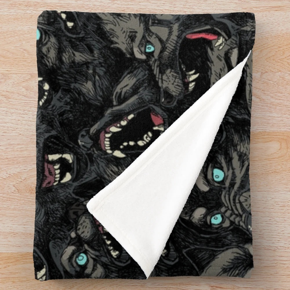 Gray wolf pack pattern printed on a soft, plush blanket