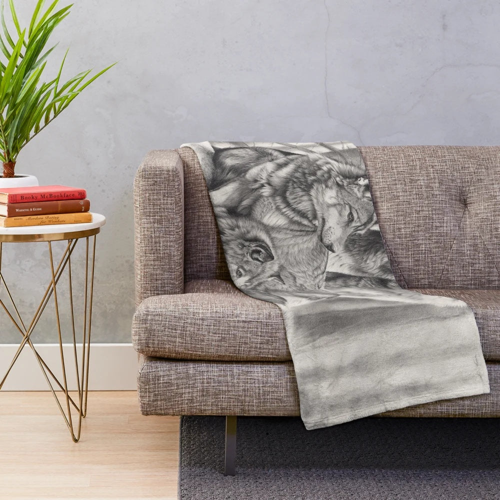 Soft and cuddly wolf plush blanket featuring a monochrome pencil drawing of a timber wolf in a forest landscape