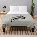 Cozy plush blanket featuring a wolf silhouette in a tribal art design