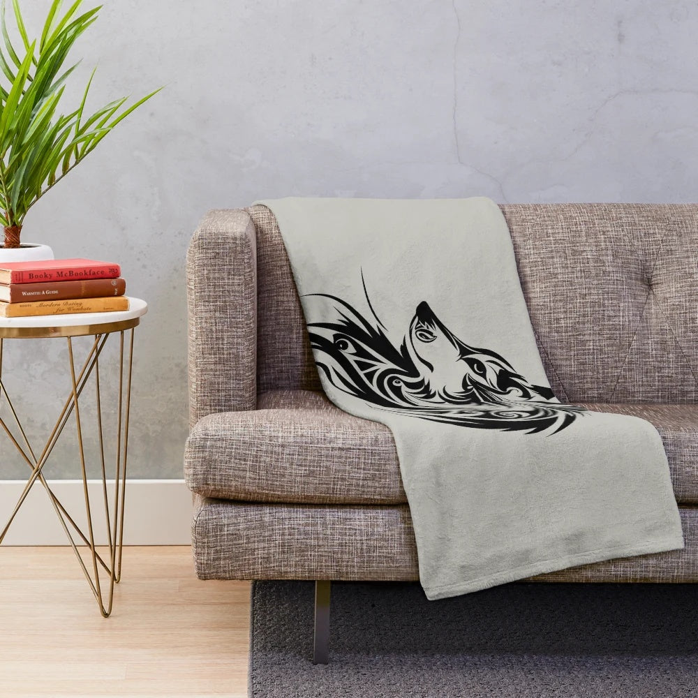 Cozy plush blanket featuring a wolf silhouette in a tribal art design