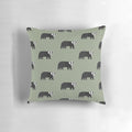 A decorative pillow featuring a whimsical black and white badger design on a green background, perfect for adding a touch of nature to any room.
