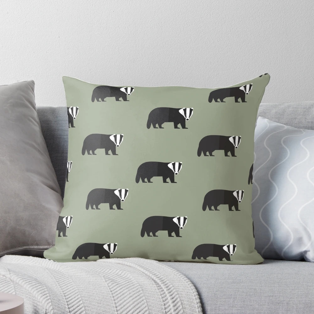 A decorative pillow featuring a whimsical black and white badger design on a green background, perfect for adding a touch of nature to any room.