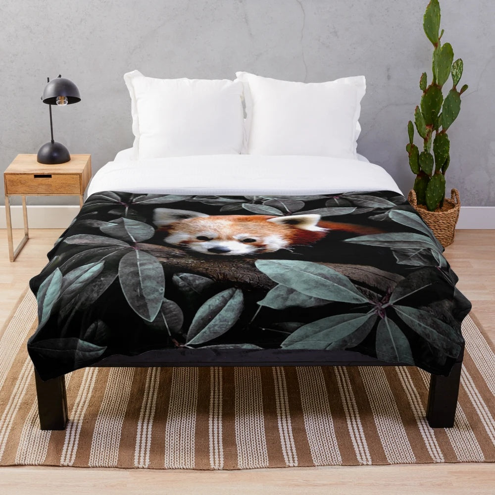 Plush blanket with nature-inspired animals and foliage