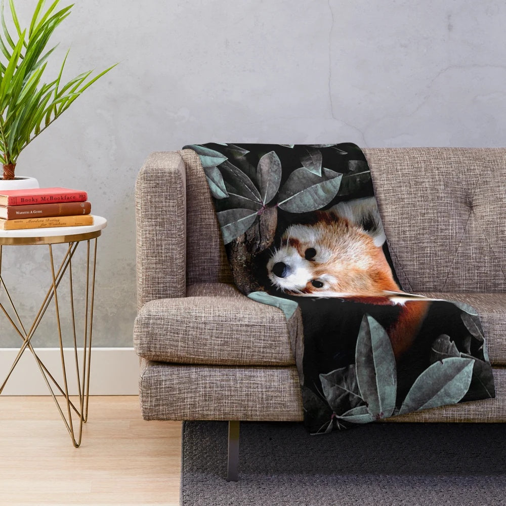 Plush blanket with nature-inspired animals and foliage