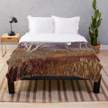 Heralds of Spring Plush Blanket featuring deer, owls, and floral elements in a woodland landscape