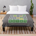 Wordle-themed plush blanket with green, yellow, and grey squares