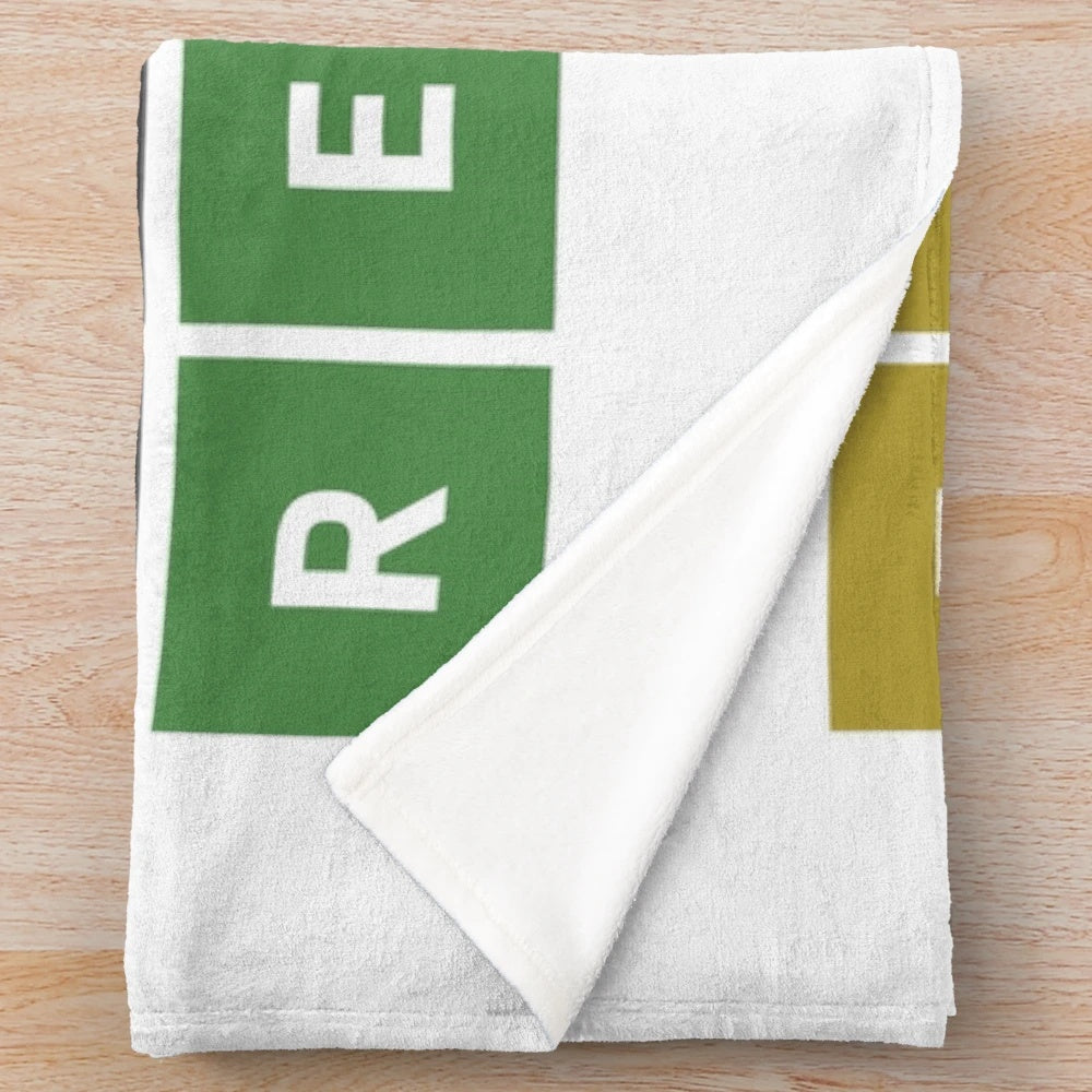 Wordle-themed plush blanket with green, yellow, and gray squares