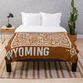 Wyoming map plush blanket featuring the outline and key landmarks of the Equality State