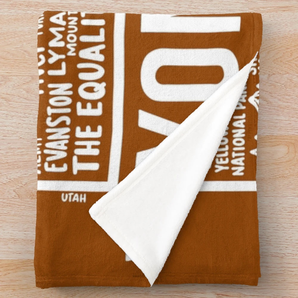 Wyoming map plush blanket featuring the outline and key landmarks of the Equality State