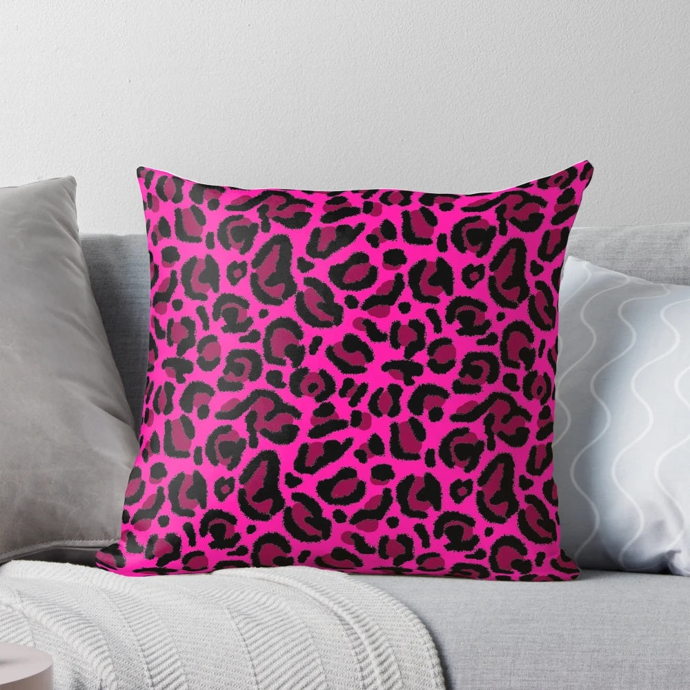 A soft and plush hot pink leopard print pillow, perfect for adding a retro y2k vibe to your home decor.