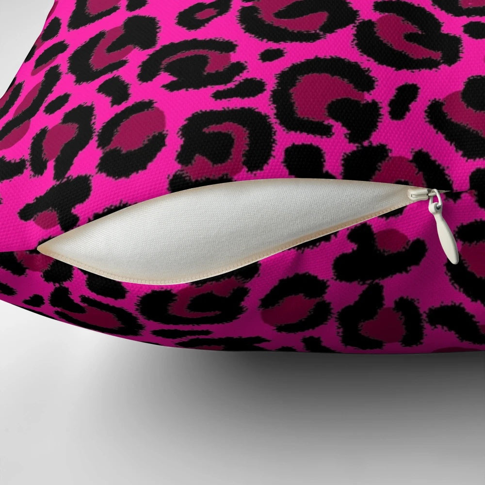 A soft and plush hot pink leopard print pillow, perfect for adding a retro y2k vibe to your home decor.
