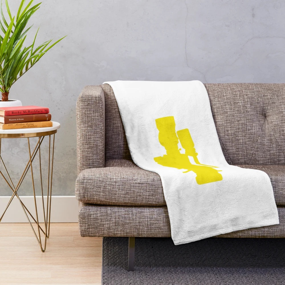 Yellow plush blanket featuring a vintage-style cinema camera design