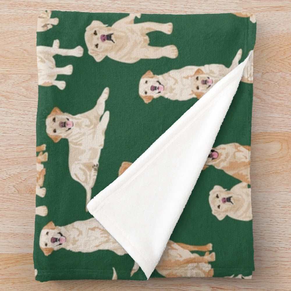 Yellow Labrador Retriever Puppy on Plush Green Blanket