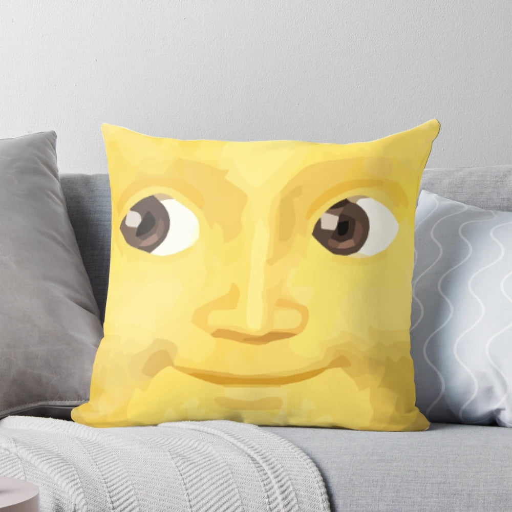Yellow moon-shaped pillow with a whimsical design