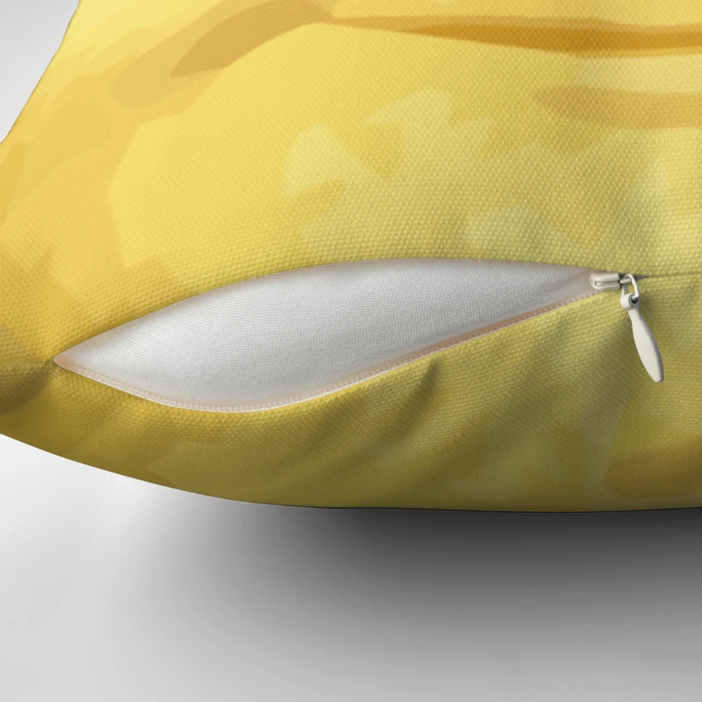 Yellow moon-shaped pillow with a whimsical design