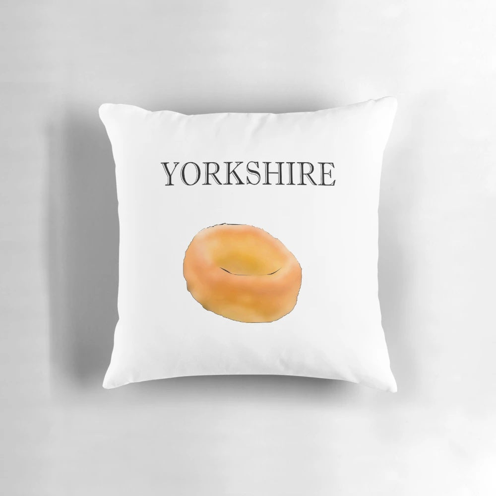 Yorkshire pudding-shaped pillow in a soft, fluffy texture.