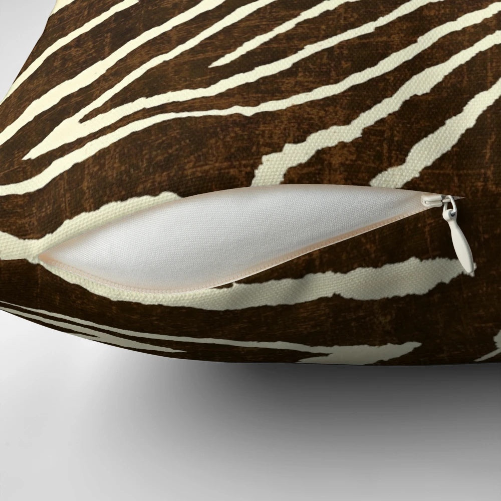 Decorative brown and beige zebra print pillow with a soft, plush texture for winter home accents.