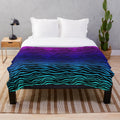 Soft and plush zebra print blanket in a gradient design