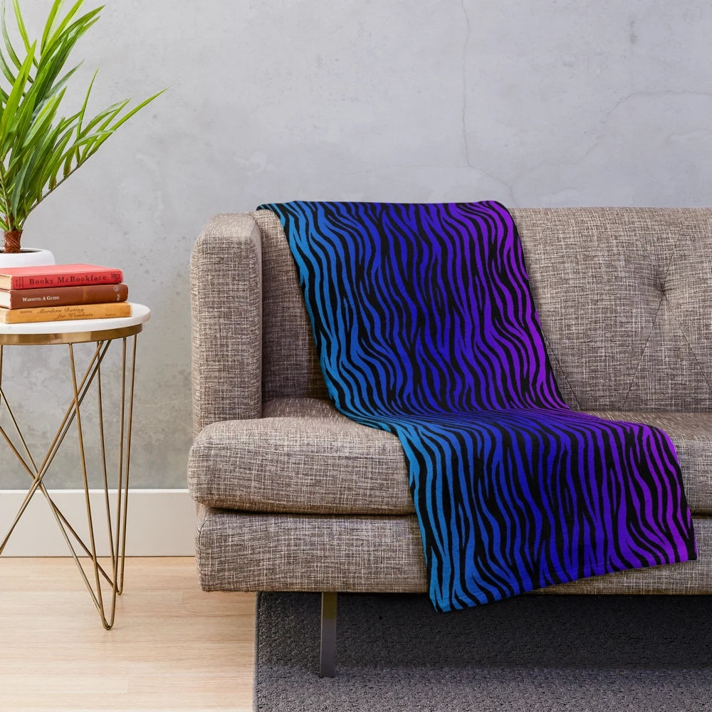 Soft and plush zebra print blanket in a gradient design