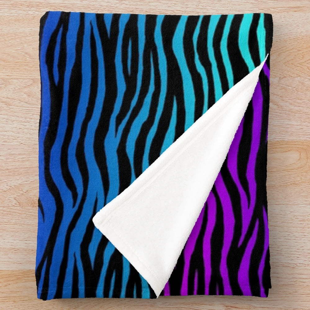 Soft and plush zebra print blanket in a gradient design