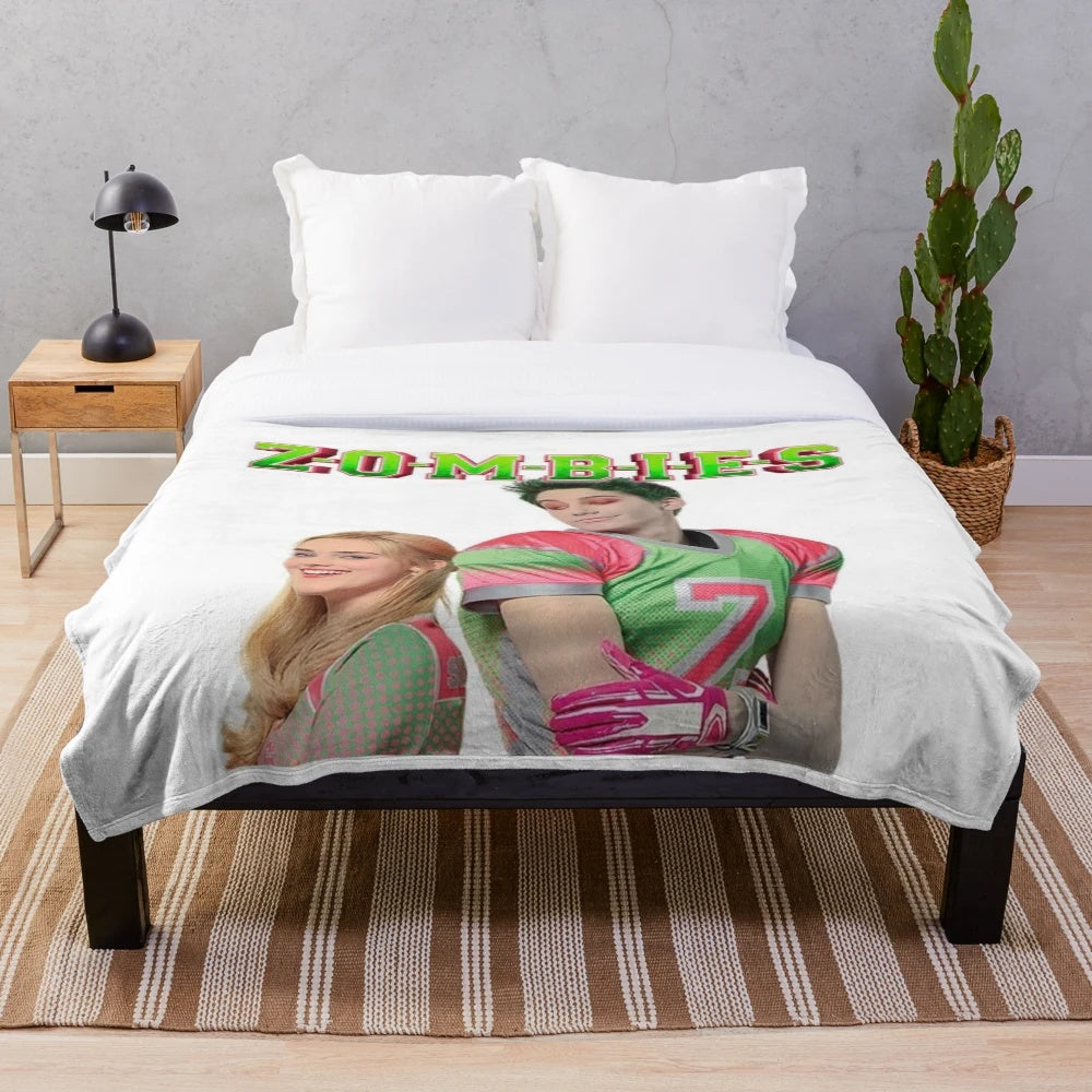 Plush blanket featuring Disney's Zombies characters Addison and Zed