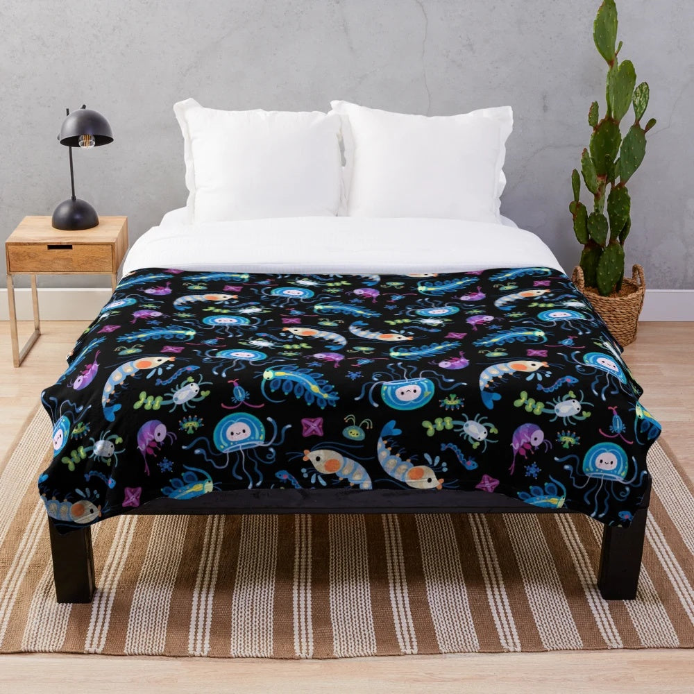 Zooplankton plush blanket featuring a variety of marine life creatures