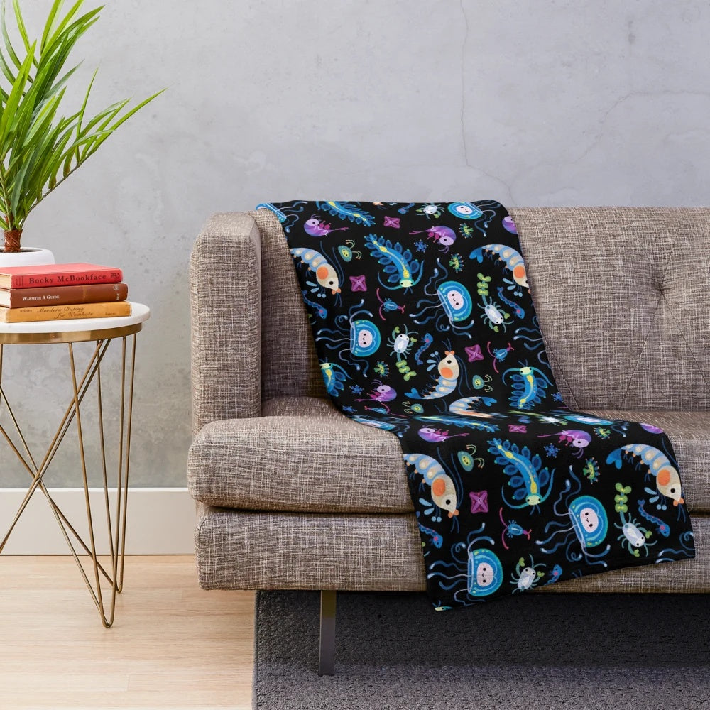 Zooplankton plush blanket featuring a variety of marine life creatures