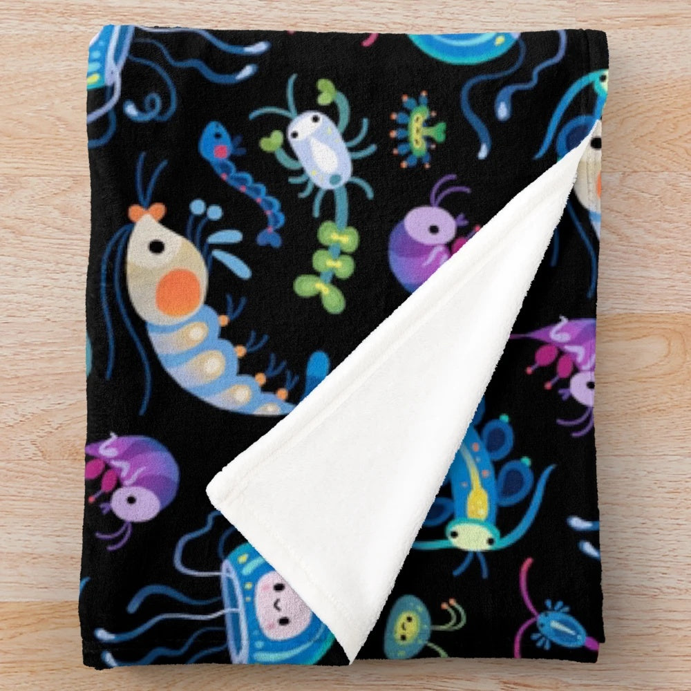 Zooplankton plush blanket featuring a variety of marine life creatures