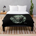 Creature from the Black Lagoon-inspired plush blanket featuring classic horror movie imagery