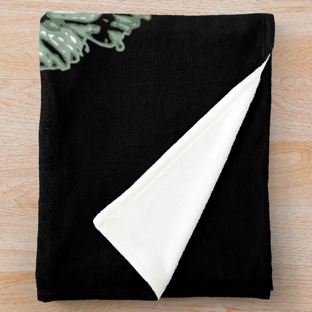 Creature from the Black Lagoon-inspired plush blanket featuring classic horror movie imagery