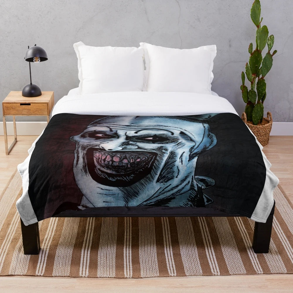 Art the Clown inspired plush blanket featuring a scary, creepy clown design