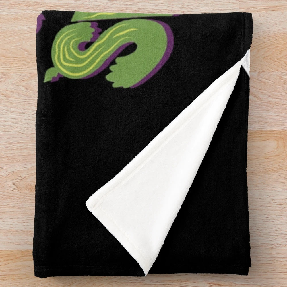 Creepy cute horror plush blanket featuring an Audrey plant inspired design