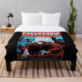 Creepshow-inspired plush blanket with horror movie imagery