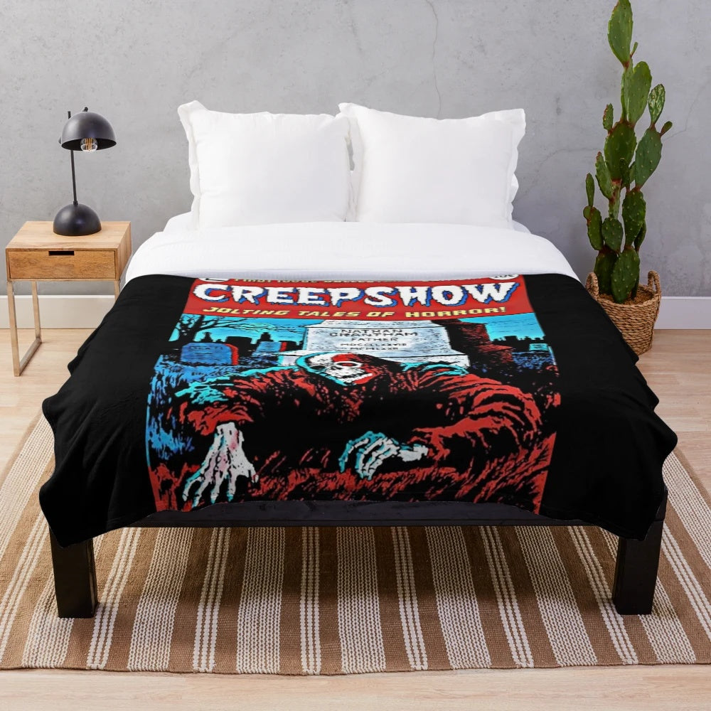Creepshow-inspired plush blanket with horror movie imagery