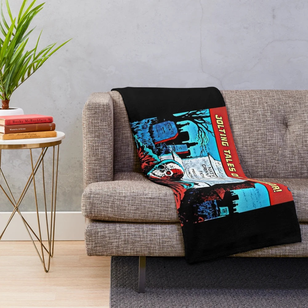 Creepshow-inspired plush blanket with horror movie imagery