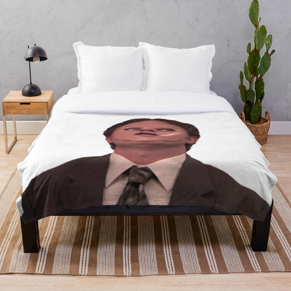 Plush blanket featuring a skin mask design inspired by the character Dwight Schrute from the TV show The Office