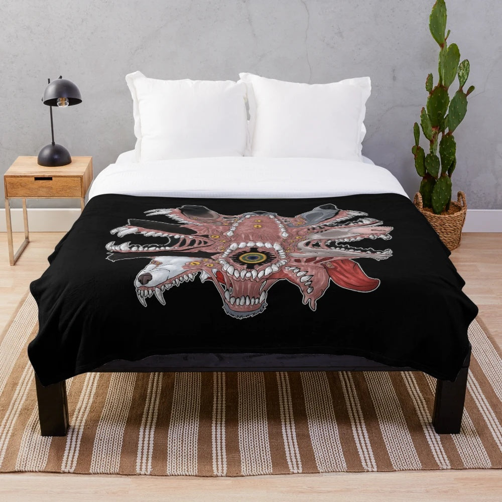 Creepy plush blanket with 30 yard grin pattern featuring eyes, teeth, and other unsettling elements