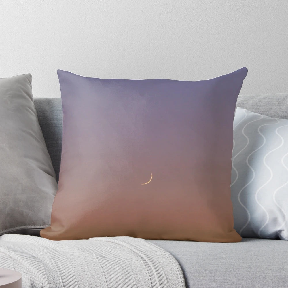 Decorative crescent moon throw pillow with sunset sky background
