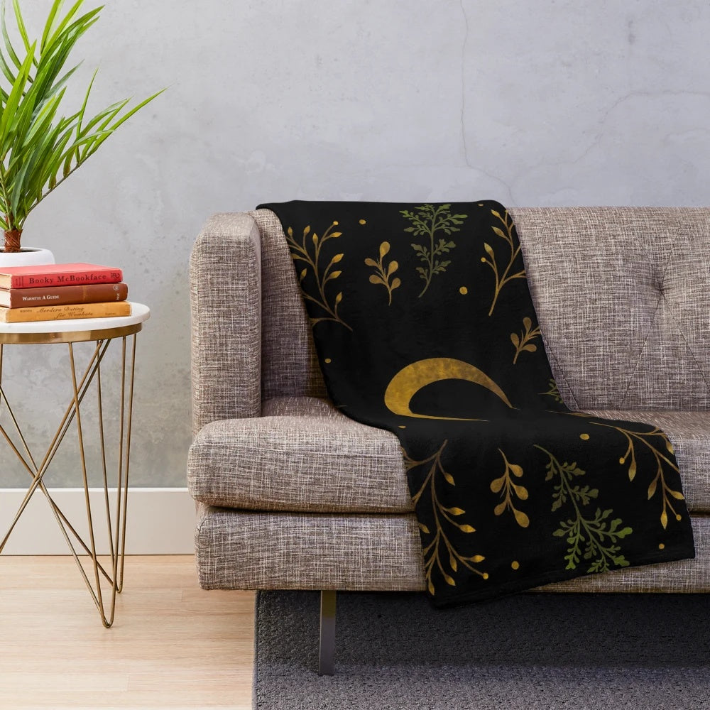 Crescent moon themed gold plush blanket with botanical floral design