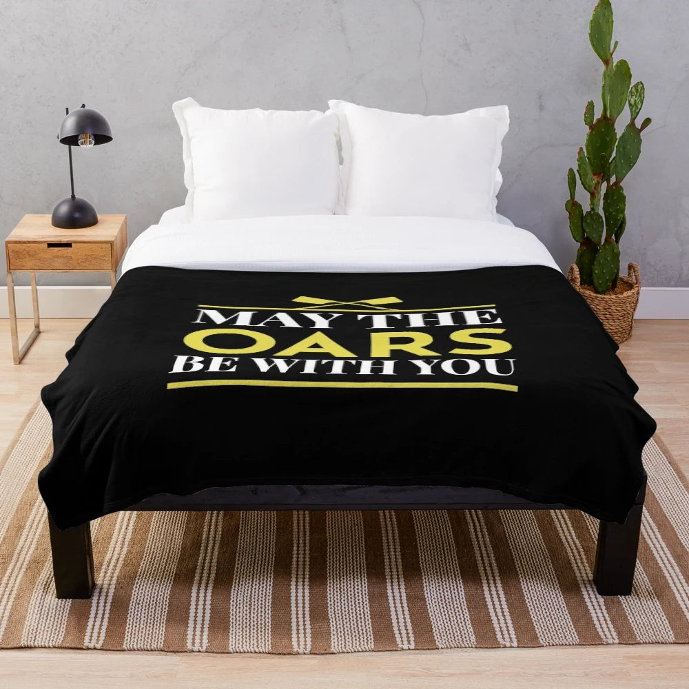 A cozy plush blanket featuring a crew rowing boat and oar design, perfect for water sport enthusiasts