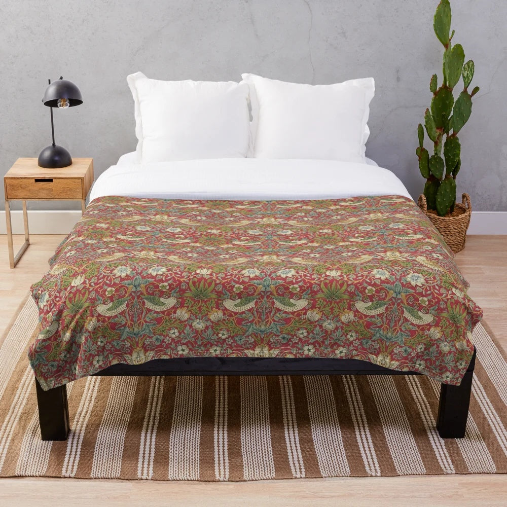 Crimson plush blanket featuring William Morris' iconic Strawberry Thief design