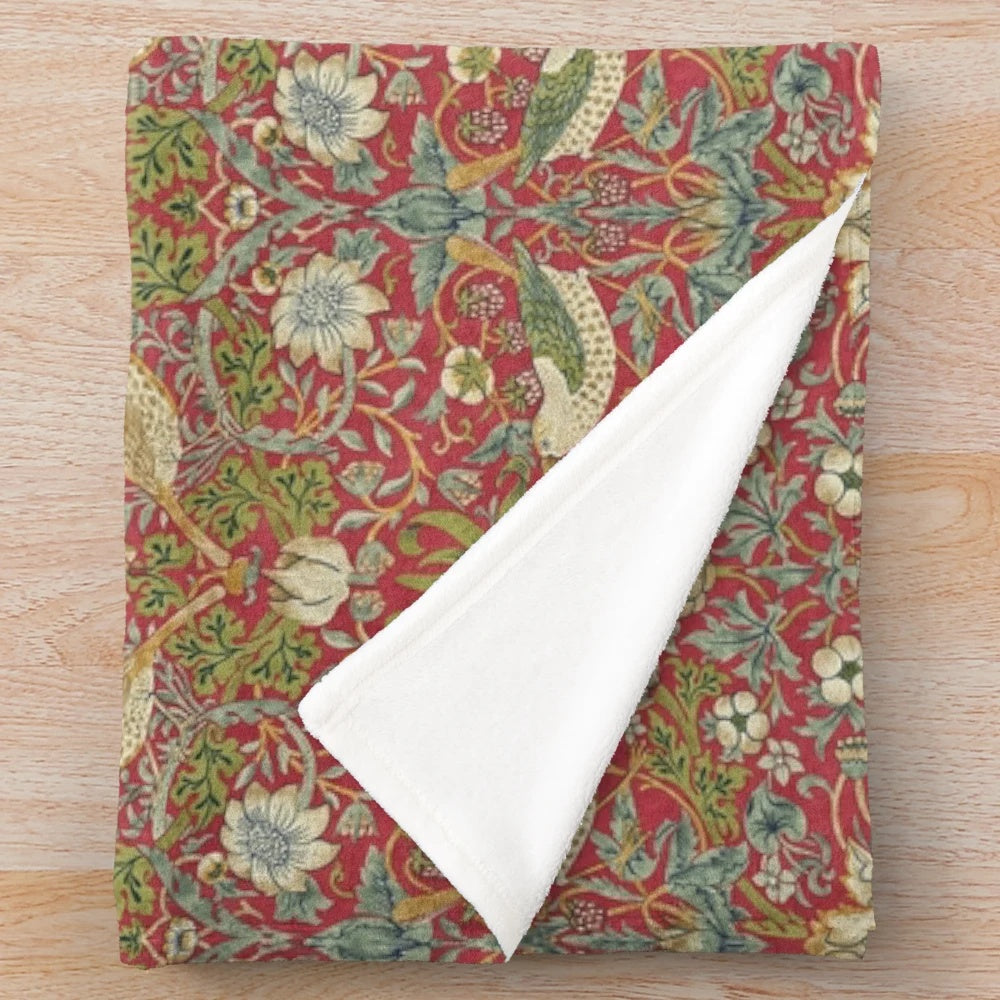 Crimson plush blanket featuring William Morris' iconic Strawberry Thief design