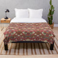 Crimson and emerald green floral pattern plush blanket with bird motif